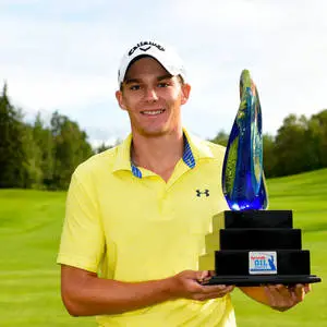 Aaron Wise Holding A Trophy