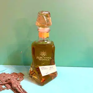  Caption: Luxurious Adictivo Extra Anejo Tequila Bottle 