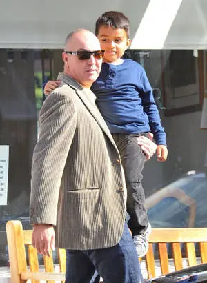 Arnold Vosloo Lovingly Carrying His Child
