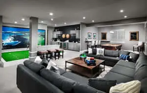 a large living room with a golf game table