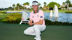 Bernhard Langer Crouching And Holding Trophy