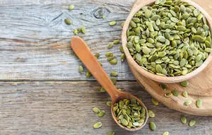 Fresh Green Lentils in Wooden Bowl and Spoon