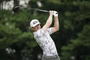 Mackenzie Hughes Holding Up Golf Club