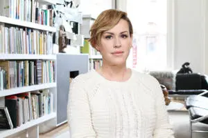  Caption: Molly Ringwald in a chic and comfortable white sweater. 