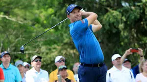 Padraig Harrington Smiling After Swinging