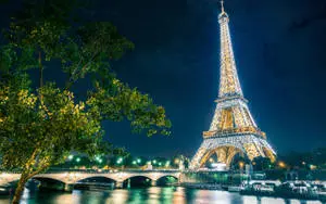 Glowing Eiffel Tower In Paris