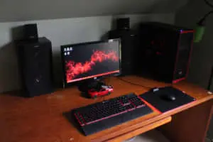 a desk with a computer and keyboard