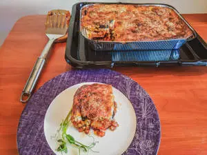Portion Of Moussaka From A Tray Of Baked Casserole
