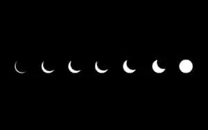 a black background with different phases of the moon