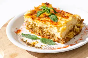 Delicious Slice of Authentic Moussaka Garnished with Basil