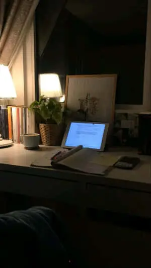 a desk with a laptop on it