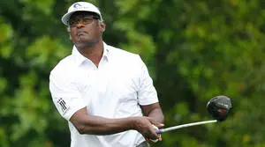 Vijay Singh Holding Out Golf Club