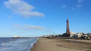 Waves Hitting Beach With Blackpool Tower In Background
