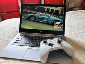 a laptop with a xbox controller on it